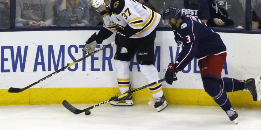 Patrice Bergeron (links), der frühere Lockout-Spieler von Lugano, strebt mit den Boston Bruins den Triumph im Final um den Stanley Cup gegen die St. Louis Blues an