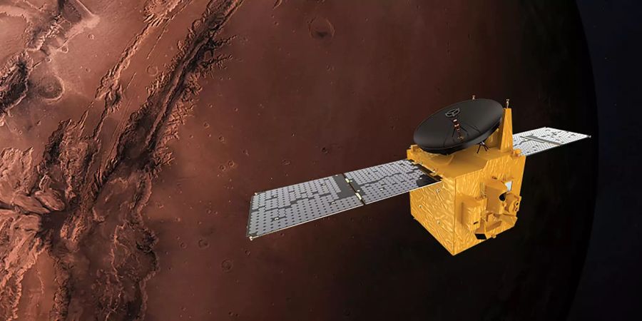 Eine Computergrafik zeigt die Marssonde Hope Probe vor dem Mars.