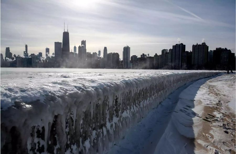 Steam rises from the city buildings and Lake Michigan in Chicago USA.