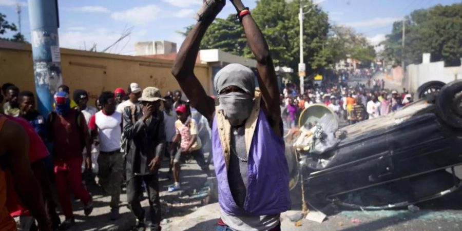Tausende Haitianer fordern den Rücktritt von Präsident J. Moise. Foto: Dieu Nalio Chery/AP