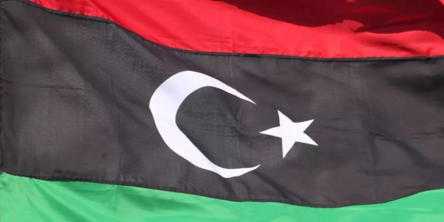 Die libysche Flagge. Foto: Sergei Ilnitsky/epa