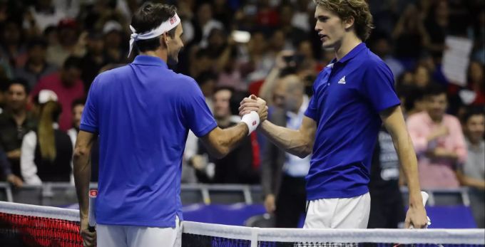 Roger Federer und Alexander Zverev beim Handschlag am Netz. Roger Federer Alexander Zverev