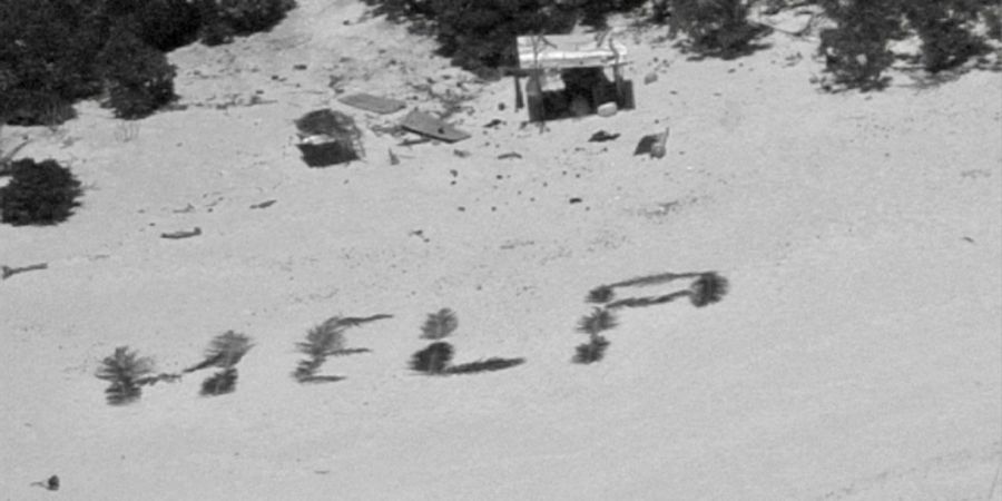 «Bemerkenswertes Zeugnis ihres Willens, gefunden zu werden»: «Help» mit Palmwedeln auf Sand geschrieben.