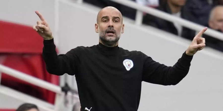 Manchester Citys Coach Pep Guardiola hat sich mit dem Coronavirus infiziert. Foto: Matt Dunham/AP/dpa