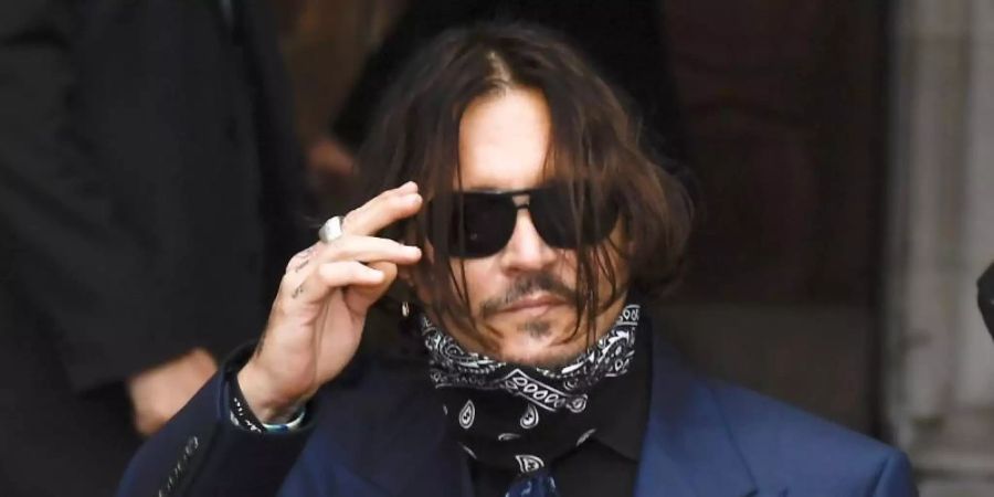 Johnny Depp auf dem Weg ins Londoner Gericht. Foto: Alberto Pezzali/AP/dpa